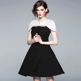 autumn new European and American commuter black and white color cloak dress