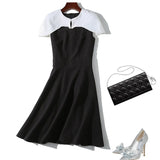 autumn new European and American commuter black and white color cloak dress