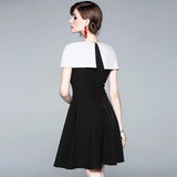 autumn new European and American commuter black and white color cloak dress