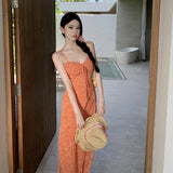 2025 This year, beautiful skirts are popular, white orange floral micro-fishtail suspender dresses, women's waist vacation dresses.