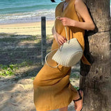 This year, it is popular, beautiful fried street age reduction fashion, ginger leaking back bow top, two-piece suit skirt for women in summer.