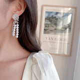 2025 Light luxury, high-end sense, excellent temperament, wedding banquet, bridal earrings, trendy long hollow camellia pearl fringed earrings