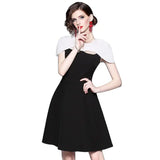 autumn new European and American commuter black and white color cloak dress